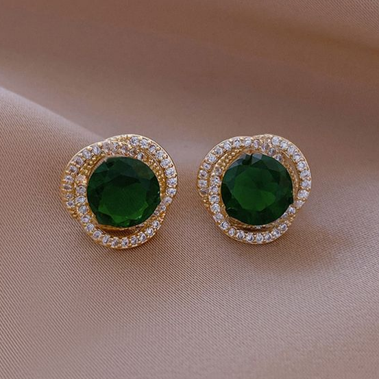 Green earrings with shiny spiral