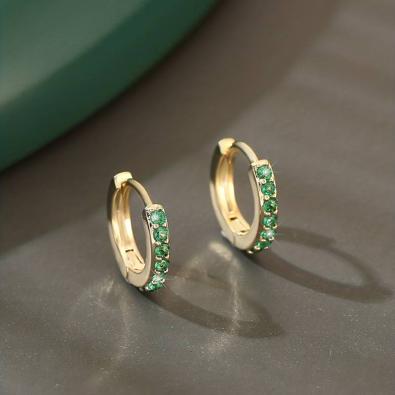 Elegant earrings with green cubic zirconia as inlay